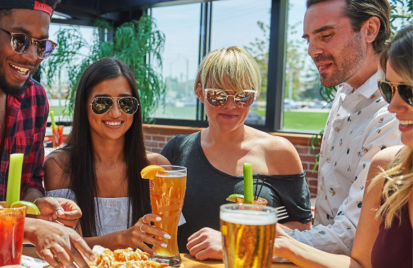 Guests on a restaurant patio in summer